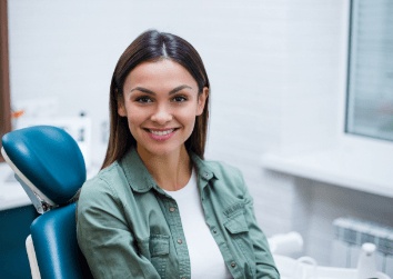 girl smiling in blue exam
