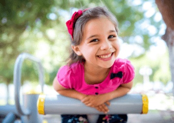 girl smiling on playground