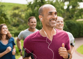 man running outside in group