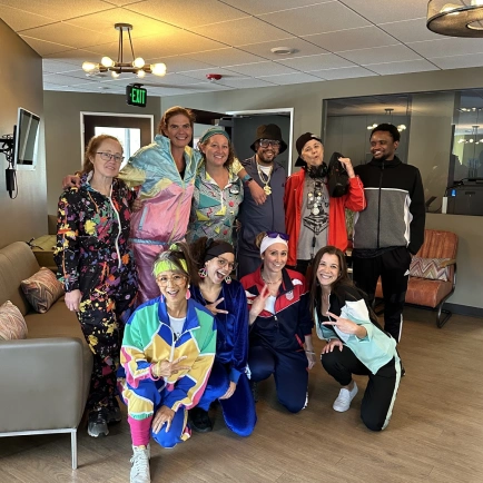 Team enjoying a family-friendly community event