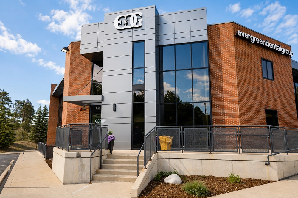Exterior of contemporary dental clinic building with glass facade