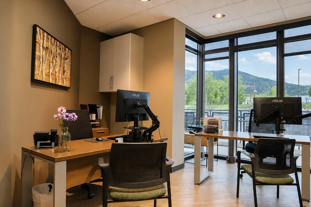 Private dental consultation office with desk and computer